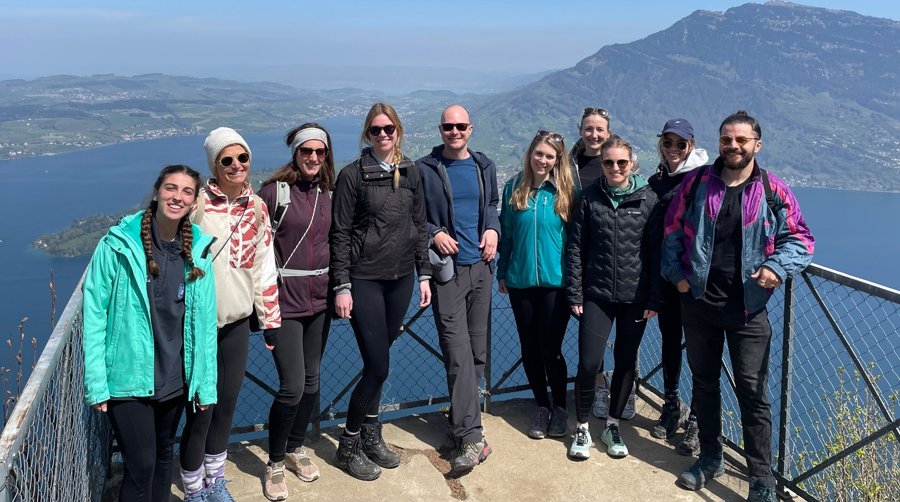 The lab on a hiking outing above a lake